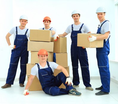 Packed moving boxes and furniture ready for transport in a Haringey home