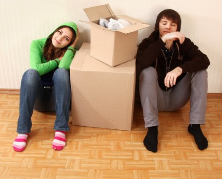 Packed moving boxes and furniture ready for delivery in Haringey