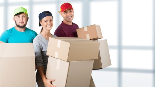 Removal team loading boxes and furniture for a Haringey home move