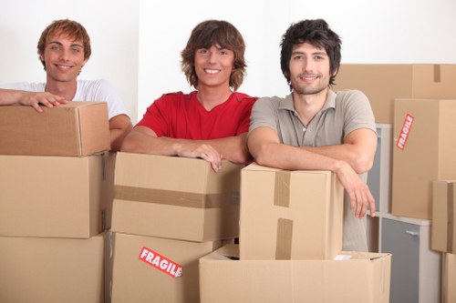Removalists transporting furniture and boxes from a Haringey property