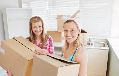 Office relocation equipment and furniture being prepared for transport